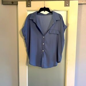 Blue button down shirt sleeve top. Worn once or twice.